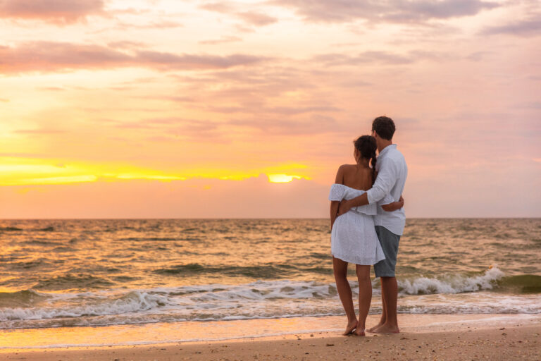 Couple Enjoying Sunset on Beach